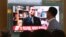 People watch a TV news program showing a file image of Thae Yong Ho, a high-profile North Korean defector, at Seoul Railway Station in Seoul, South Korea, Aug. 17, 2016