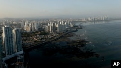 The setting sun lights up the Panama City skyline, April 4, 2016. A searchable database of a Panamanian law firm's documents revealing details of more than 200,000 offshore entities is to be released Monday.