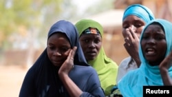 FILE - Boko Haram attacks on the Nigerian town of Gulak forced these women to flee to a refugee camp in September. Regional armies are mobilizing a joint force of 8,700 men to try to defeat the Islamic extremist group. 