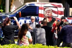 Conservative political consultant Roger Stone, center, arrives outside the convention center at the Conservative Political Action Conference, Feb. 27, 2021, in Orlando, Fla.