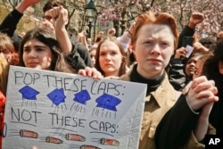 High school students protest during a rally calling for stronger laws on firearms, April 20, 2018, in Washington Square Park, New York.