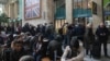 Travelers wait as Eurostar trains to London and all trains heading to northern France were stopped following the discovery of an unexploded bomb dating back to World War II near the tracks, March 7, 2025, at the Gare du Nord station in Paris. 