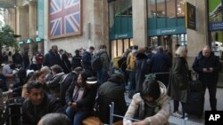 Travelers wait as Eurostar trains to London and all trains heading to northern France were stopped following the discovery of an unexploded bomb dating back to World War II near the tracks, March 7, 2025, at the Gare du Nord station in Paris. 