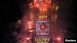 Fireworks and confetti mark the new year in Times Square in New York, U.S. Jan. 1, 2017.