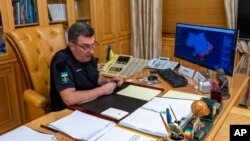 FILE - The head of Ukraine's powerful National Security and Defense Council, Oleksiy Danilov, is seen at his office in Kyiv, Ukraine, Sept. 2, 2022. 