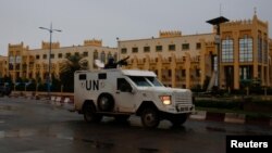 FILE - A UN vehicle patrols the streets before the polls open for the presidential election in Bamako, Mali, July, 29 2018.