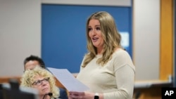 FILE - Jenna Ellis reads a statement inside Fulton Superior Court Judge Scott McAfee's Fulton County, Ga., courtroom, Oct. 24, 2023, in Atlanta. 