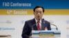 FILE - Qu Dongyu from China addresses a plenary meeting of the 41st Session of the Conference, at the FAO headquarters in Rome, June 22, 2019.