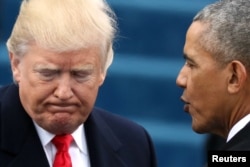 FILE - U.S. President Barack Obama (R) greets President-elect Donald Trump at inauguration ceremonies swearing in Trump as president on the West front of the U.S. Capitol in Washington, Jan. 20, 2017.