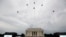 The U.S. Army Band performs and the U.S. Navy Blue Angels fly over at the end of an Independence Day celebration in front of the Lincoln Memorial, July 4, 2019, in Washington.