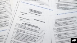 Pages from a FBI property list of items seized from former President Donald Trump's Mar-a-Lago estate and made public by the Department of Justice, are photographed on Sept. 2, 2022.