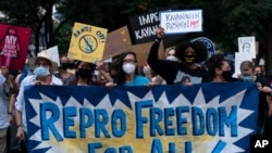 Abortion rights demonstrators march to the Supreme Court Justice Brett Kavanaugh's home in Chevy Chase, Md. Sept. 13, 2021, after a high-profile decision earlier this month in which the court by 5-4 vote declined to step in to stop a Texas law banning most abortions in the state.