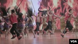 FILE - Wa dancers perform a traditional number during the 30-year anniversary festivities in Panghsang, Special Region 2, Shan state, Myanmar, April 16, 2019. (Am Sandford/AsiaReports)