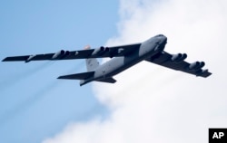FILE - A U.S. Air Force B-52 strategic bomber flies over Pabrade during a military exercise some 60 km (38 miles) north of the capital Vilnius, Lithuania, June 16, 2016.