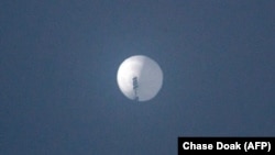 This photo by Chase Doak taken Feb. 1, 2023, and released Feb. 2 2023, shows a suspected Chinese spy balloon in the sky over Billings, Montana.