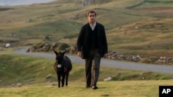 This image released by Searchlight Pictures shows Colin Farrell in a scene from "The Banshees of Inisherin."