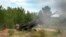 FILE - Ukrainian soldiers fire at Russian positions from a U.S.-supplied M777 howitzer in Ukraine's eastern Donetsk region, June 18, 2022. As the anniversary of the Russian invasion of Ukraine nears, some Americans are growing weary of providing support to Ukraine.