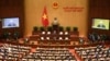 FILE - Vietnam's Communist Party general secretary Nguyen Phu Trong (back R) addresses the opening session of the newly-elected 15th National Assembly's first parliament session in Hanoi, July 20, 2021. 