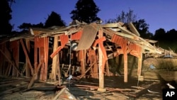This photo provided by the Free Burma Rangers shows remains of a destroyed school in Lay Wah, in Karen state’s Mutraw district, Myanmar, Jan. 12, 2023. A report released Jan. 16, 2023, details how companies have helped Myanmar produce weapons that are used to commit atrocities.
