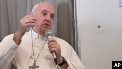 Pope Francis speaks to journalists during an airborne press conference aboard his plane back to Rome, at the end of his pastoral visit to Africa, Feb. 5, 2023.
