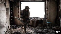 A Ukrainian serviceman of the State Border Guard Service works in a position in Bakhmut, Ukraine, Feb. 9, 2023.