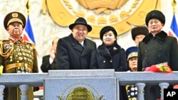 In this photo provided by the North Korean government, North Korean leader Kim Jong Un, center left, and his daughter attend a military parade to mark the 75th founding anniversary of the Korean People’s Army in Pyongyang, North Korea, Feb. 8, 2023.