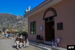 School students arrive at the Darra Adam Khel Library in Darra Adamkhel town, 35 kilometers south of Peshawar, Pakistan, Dec. 14, 2022.
