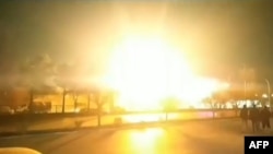 This image grab taken from a UGC video posted on Jan. 29, 2023, reportedly shows an explosion in Iran's Isfahan province. Iran said a night-time drone attack targeted a defense ministry site.