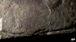 The runestone found at Tyrifjorden, Norway, is shown at the Museum of Cultural History in Oslo, Thursday, Jan. 12, 2023. (Javad Parsa/NTB Scanpix via AP)