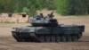 FILE - A Leopard 2 A7 main battle tank of the German armed forces Bundeswehr takes part in an educational practice in Munster, Germany, on May 20, 2019.
