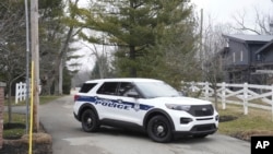 Police secure the entrance to the neighborhood of former Vice President Mike Pence's home in Carmel, Indiana, Feb. 10, 2023.
