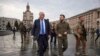 In this image provided by the Ukrainian Presidential Press Office, Ukrainian President Volodymyr Zelenskyy, center right, and Britain's Prime Minister Boris Johnson, center left, walk during Johnson's visit, in downtown Kyiv, Ukraine, April 9, 2022.