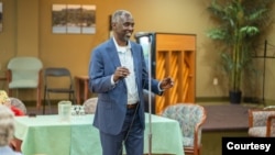 Ali Duale, seen here addressing a community event in Halifax, came to Canada as a refugee from Somalia in 1997 and was elected to the Nova Scotia provincial legislature last year. (Photo courtesy of A. Duale's office)