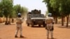 FILE - Soldiers of the U.N. peacekeeping mission in Mali MINUSMA patrol in the streets of Gao, Mali, July 24, 2019.