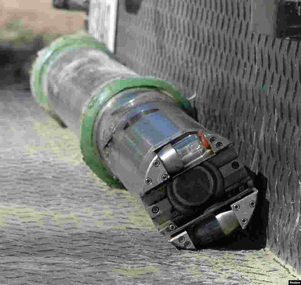 A high resolution dual lens camera system sits on the back bumper of a truck waiting to be lowered into an 1,868-foot shaft as part of the rescue effort at the Crandall Canyon Mine&nbsp;in Huntington, Utah for six trapped miners, Aug. 11, 2007. (Reuters)