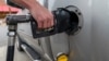 A customer gets gasoline at a gas station in Plains, Pennsylvania, U.S. Oct. 19, 2022.