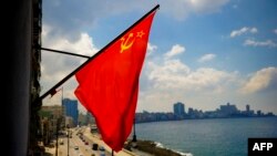 FILE - A Soviet Union flag is seen on a building in Havana, April 24, 2019.