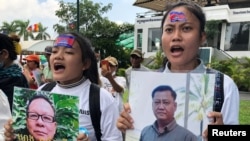 FILE - Cambodia's exiled opposition leader Sam Rainsy talks to the media outside Parliament House in Kuala Lumpur, Malaysia, Nov. 12, 2019. 