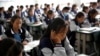 FILE - Students attend a class at the Wenchang Middle School in Yuexi county, during a government-organized media tour in Liangshan Yi Autonomous Prefecture, Sichuan province, China, Sept. 11, 2020. 