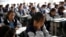 FILE - Students attend a class at the Wenchang Middle School in Yuexi county, during a government-organized media tour in Liangshan Yi Autonomous Prefecture, Sichuan province, China, Sept. 11, 2020. 