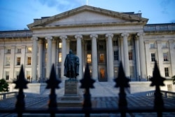 The U.S. Treasury Department building at dusk, June 6, 2019, in Washington.