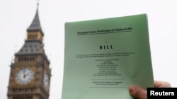 FILE - The passage of the Brexit Article 50 bill, shown in front of the Houses of Parliament in London, Jan. 26, 2017, starts Great Britain's process of leaving the European Union.