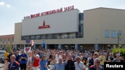 People attend an opposition demonstration to protest against presidential election results near the Minsk Automobile Plant (MAZ) in Minsk, Belarus, Aug. 17, 2020. 