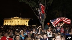 Crowds gathers outside the White House in Washington early Moday to celebrate after President Barack Obama announced the death of Osama bin Laden, May 2, 2011
