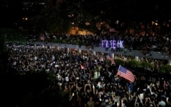 FILE - Anti-government demonstrators march in protest against the invocation of the emergency laws in Hong Kong, China, Oct. 14, 2019.