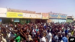 In this handout image provided a Sudanese activist, people chant slogans during a demonstration in Kordofan, Sudan, Dec. 25, 2018.