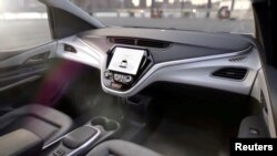 FILE - GM's planned Cruise AV driverless car features no steering wheel or pedals in this image from video, released Jan. 12, 2018.
