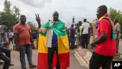 FILE - Thousands march, July 10, 2020, in Bamako, Mali, in anti-government demonstrations urged by an opposition group that rejects the president's promises of reforms.