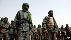 Malian troops join with former rebels before a joint patrol in Gao, Mali, Feb. 23, 2017. Gao has been a target of attacks by Islamic extremists, including one in January that killed 54.