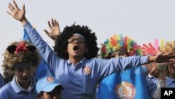 Cambodian group of comedians and supporters of Prime Minister Hun Sen's Cambodian People's Party, take part in a rally on the final campaign for the June 3 commune elections, in Phnom Penh, Friday, June 1, 2012. 